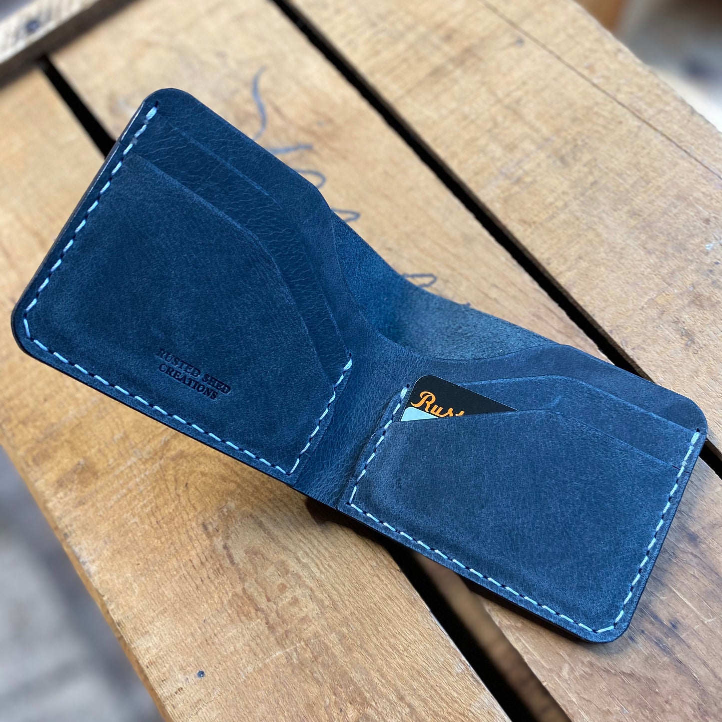 water buffalo leather wallet on a wooden surface