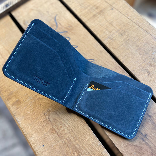 water buffalo leather wallet on a wooden surface